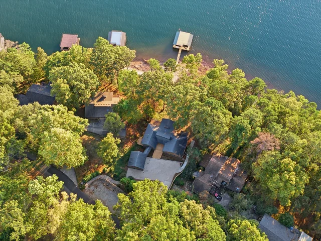 Overhead drone view of the home, trees and docks at 5685 Cherokee Trace