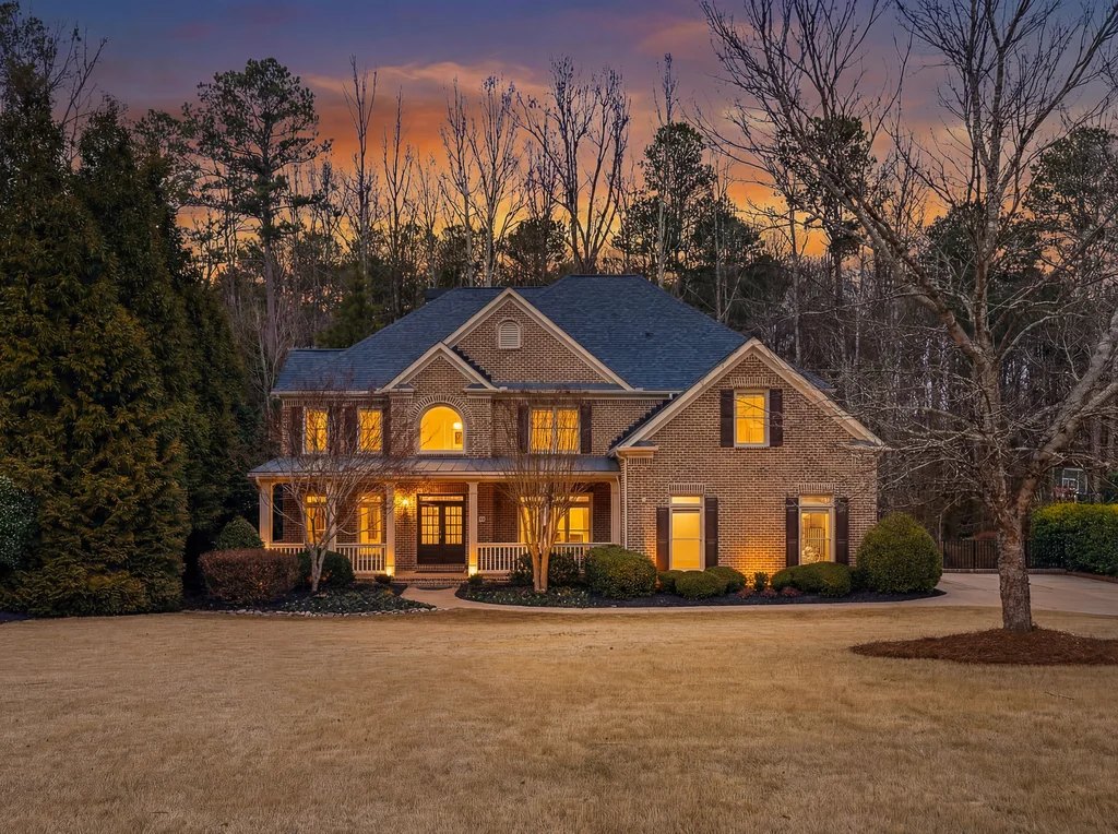 Brick home lit at twilight at 2755 Aldrich Drive, Cumming