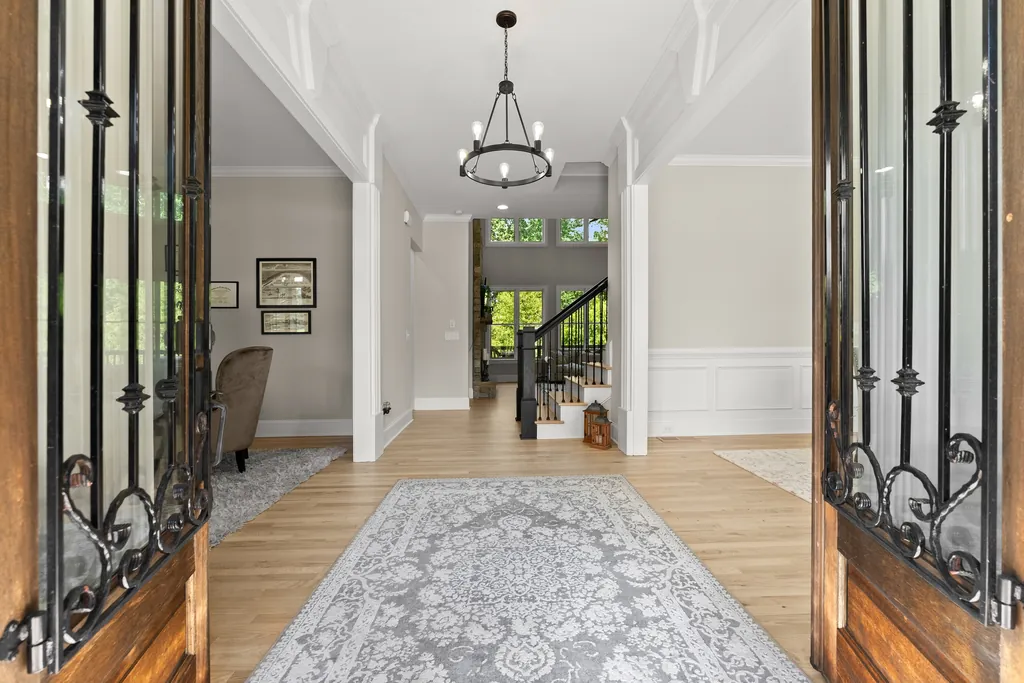 Foyer seen through wrought iron double front doors at 6625 Baywood Run