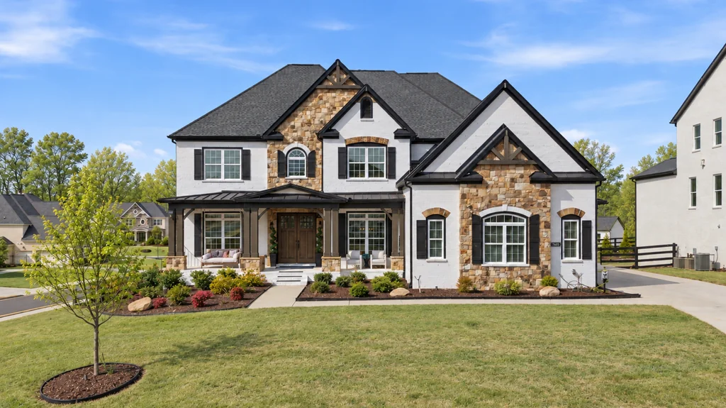 Stone and white farmhouse exterior at 7605 Poppy Mill Lane, Cumming